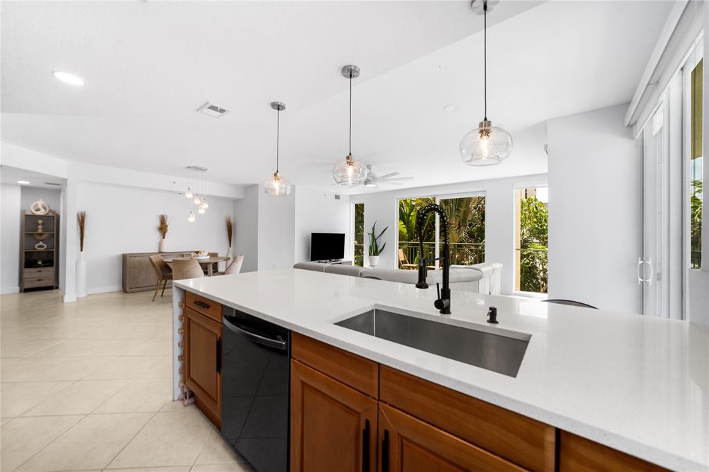 3210 Northeast 5th Street, Unit 203 Pompano Beach, FL 33062 - Photo 16 of 61 a kitchen with sink and window