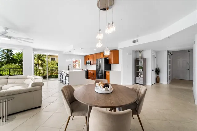 a front view of a house with a yard and fountain