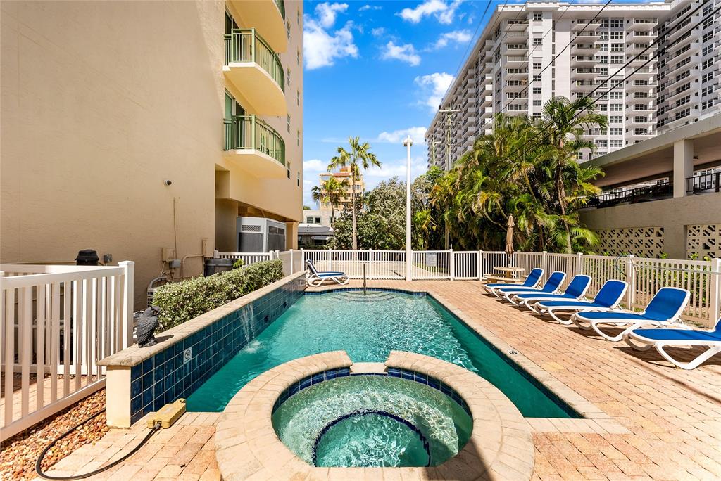 3210 Northeast 5th Street, Unit 203 Pompano Beach, FL 33062 - Photo 19 of 61 a view of swimming pool from a balcony