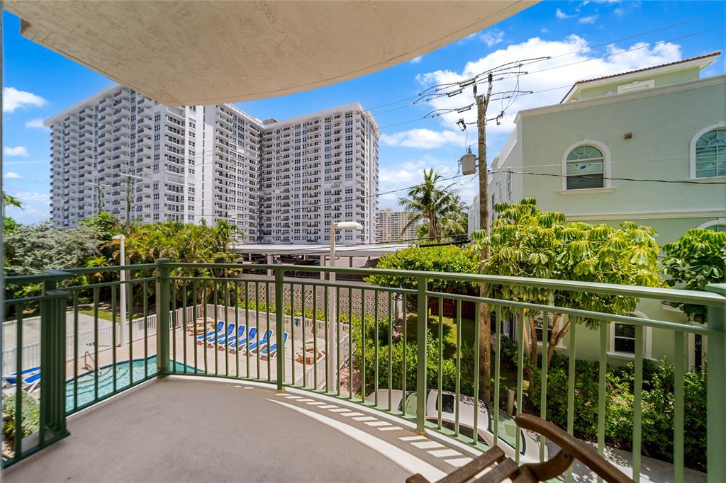 3210 Northeast 5th Street, Unit 203 Pompano Beach, FL 33062 - Photo 27 of 61 a view of a balcony with potted plants