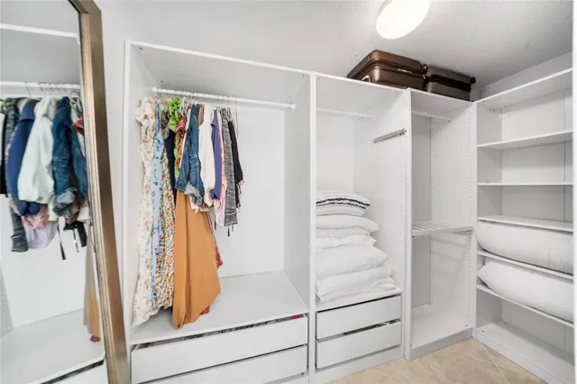 a view of walk in closet with window