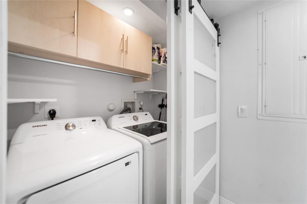 3210 Northeast 5th Street, Unit 203 Pompano Beach, FL 33062 - Photo 45 of 61 a utility room with dryer and washer