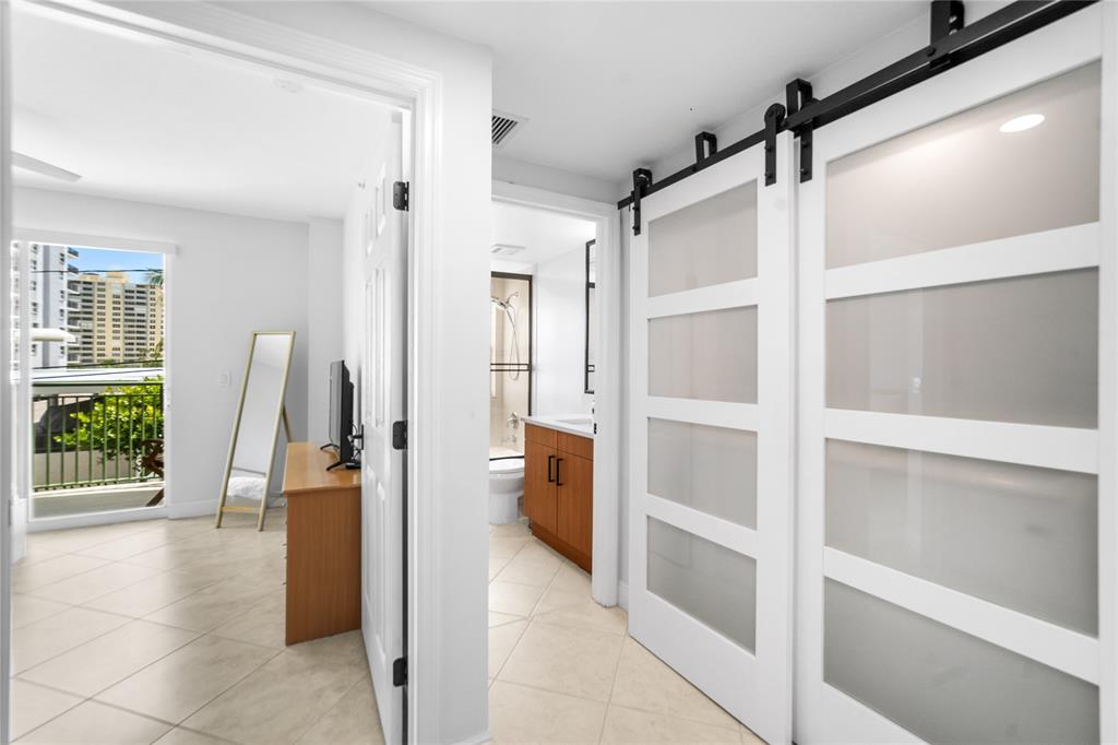 3210 Northeast 5th Street, Unit 203 Pompano Beach, FL 33062 - Photo 47 of 61 a view of walk in closet with window