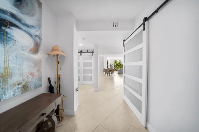 a view of a swimming pool with a deck and furniture