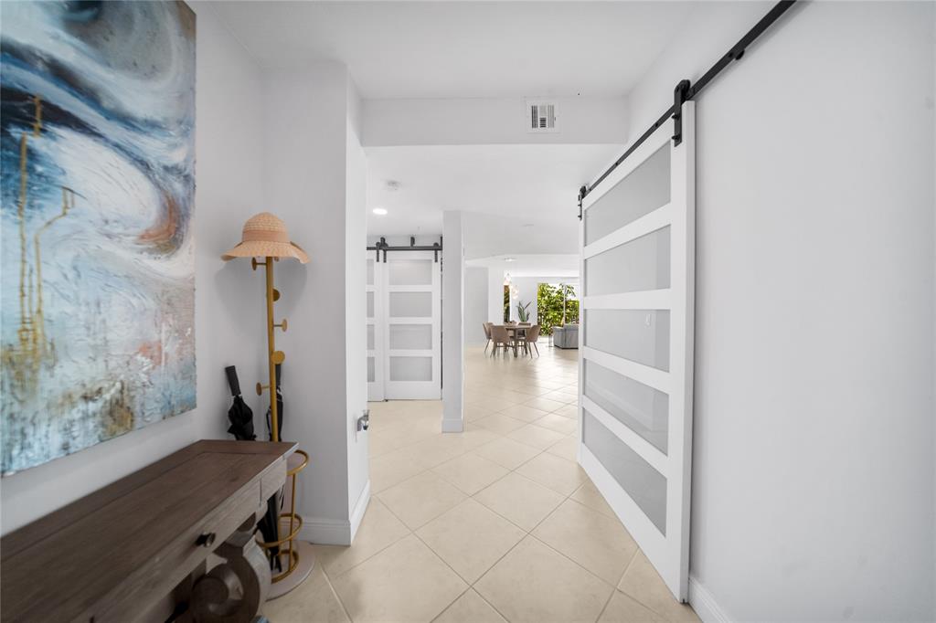 3210 Northeast 5th Street, Unit 203 Pompano Beach, FL 33062 - Photo 49 of 61 a view of entryway and workspace