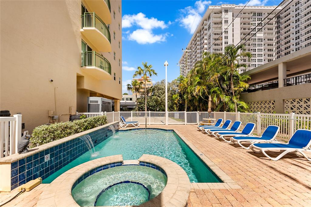 3210 Northeast 5th Street, Unit 203 Pompano Beach, FL 33062 - Photo 55 of 61 a view of swimming pool with outdoor seating