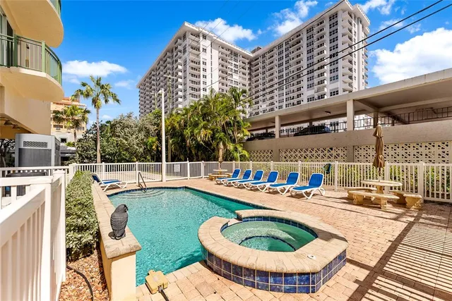 a view of a swimming pool with a patio
