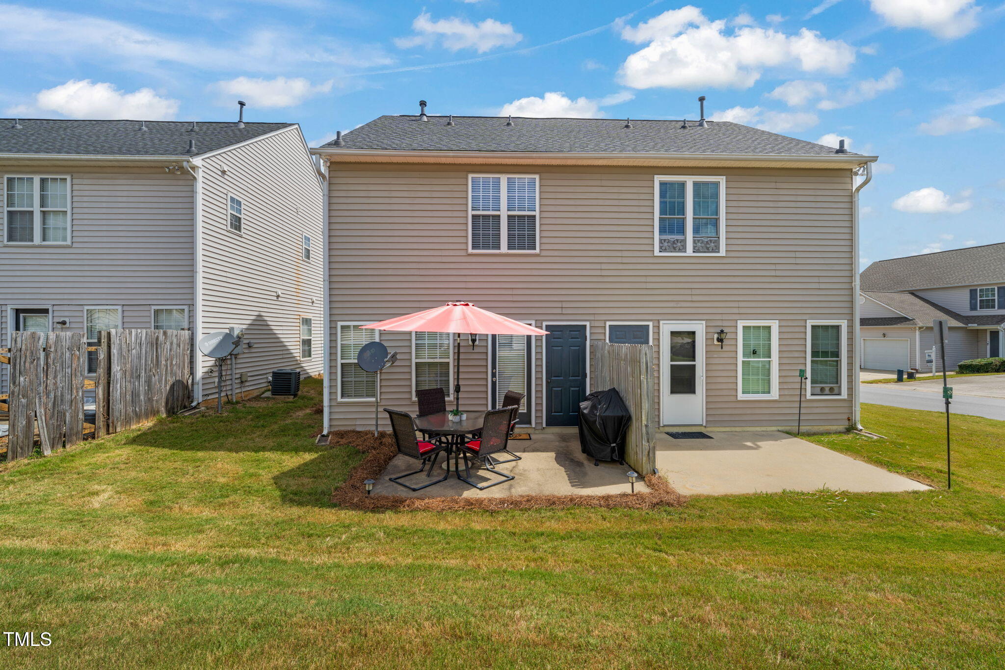 2203 Whistling Straits Way Raleigh, NC 27604 - Photo 20 of 32 a view of a house with a yard patio and fire pit