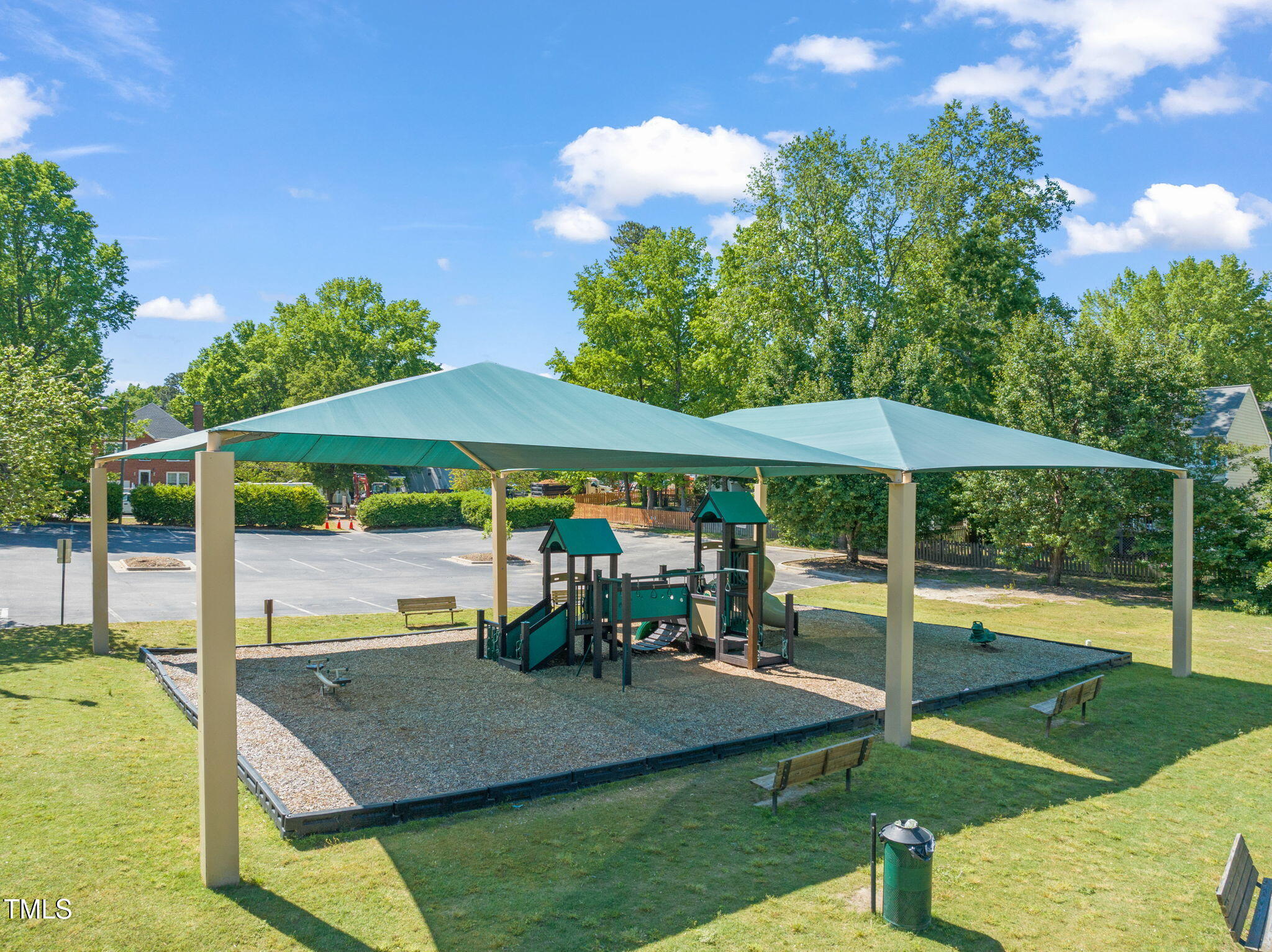 2203 Whistling Straits Way Raleigh, NC 27604 - Photo 29 of 31 a view of a patio with table and chairs under an umbrella