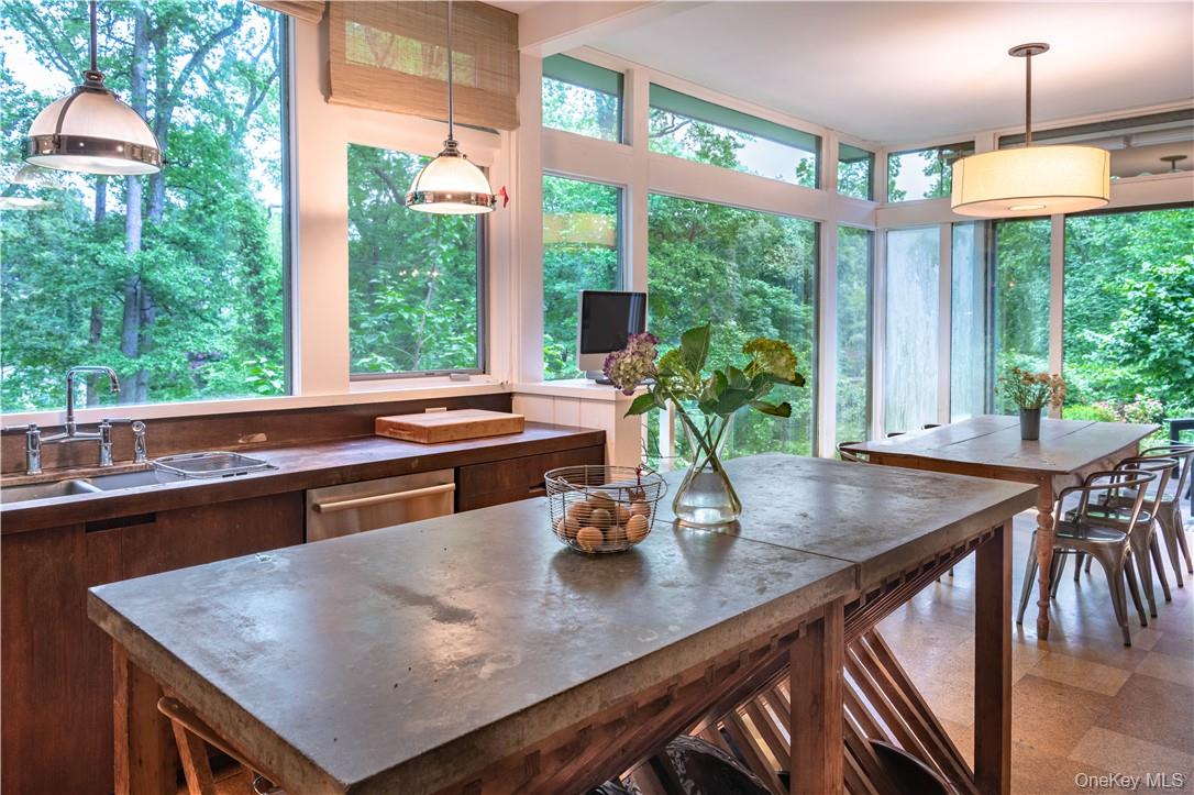 21 Woods Road Palisades, NY 10964 - Photo 12 of 47 a kitchen with a table chairs and wooden floor
