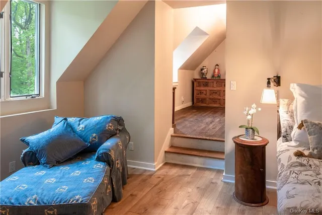 a view of a dining room with furniture and a window