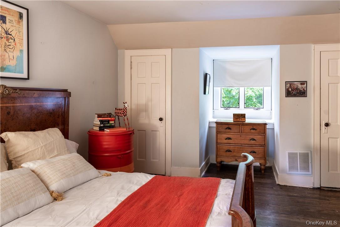 21 Woods Road Palisades, NY 10964 - Photo 24 of 47 a bedroom with a bed and wooden floor