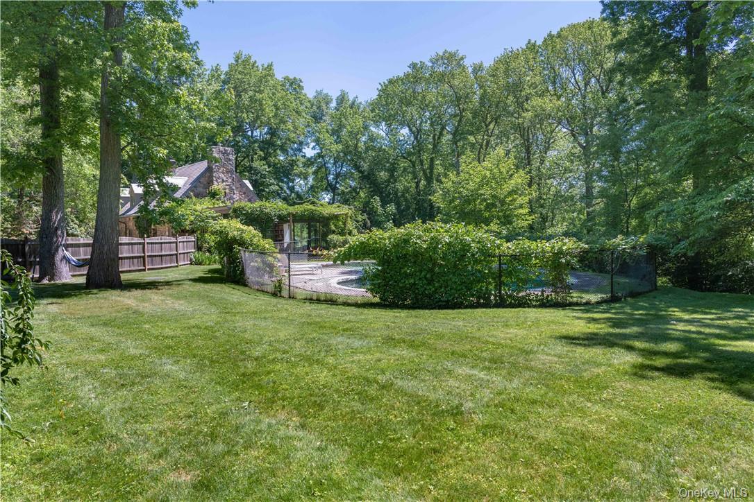 21 Woods Road Palisades, NY 10964 - Photo 29 of 47 a backyard of a house with lots of green space and fountain