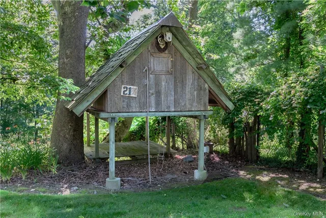 a view of a house with brick walls