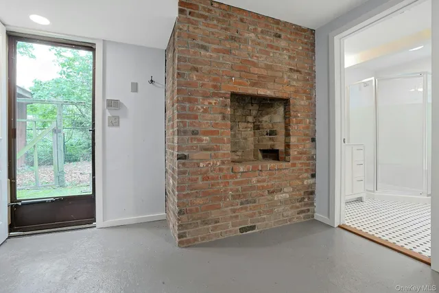 a view of a room with furniture window and wooden floor