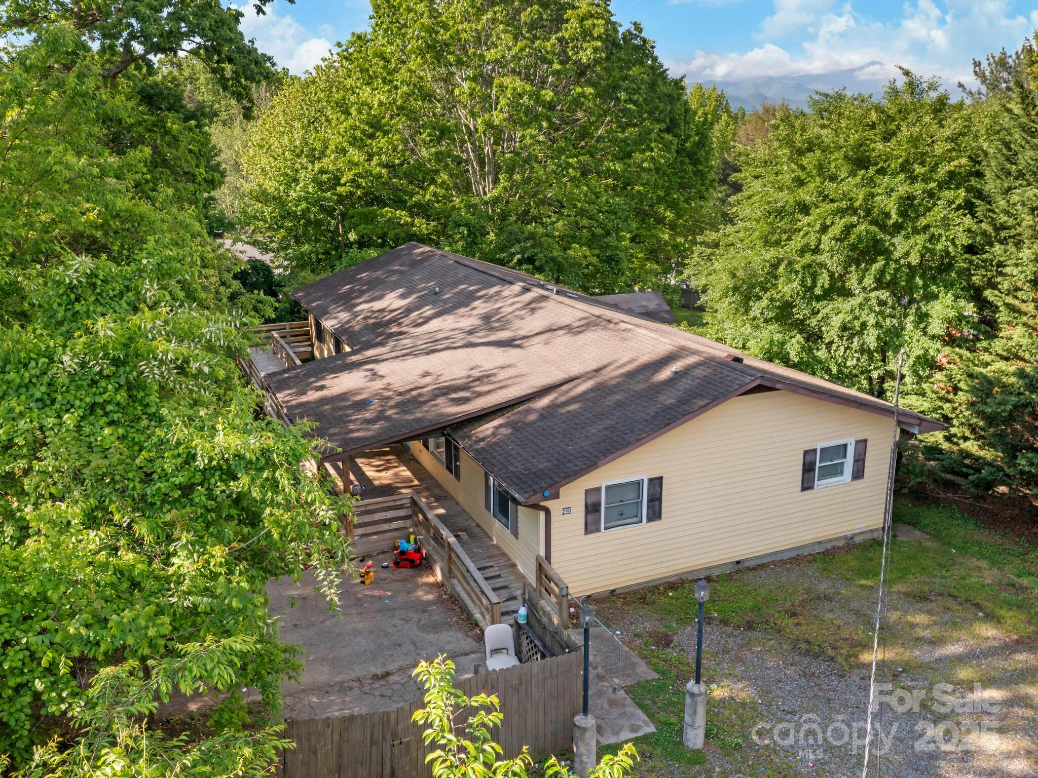 a house with trees in the background