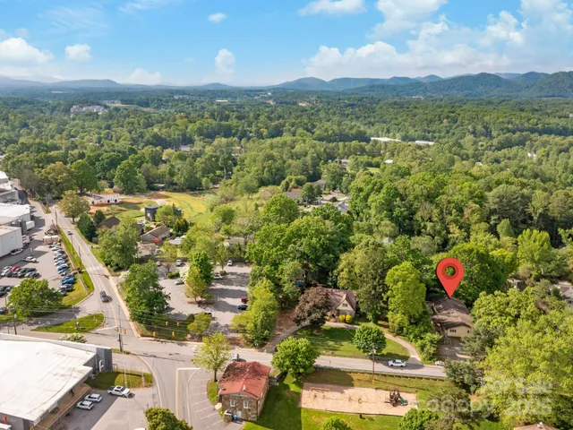 an aerial view of residential house with outdoor space and mountain view