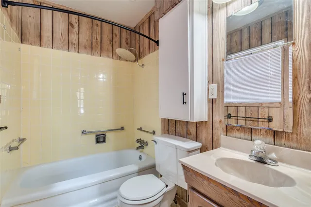 a bathroom with a sink a toilet and a bathtub