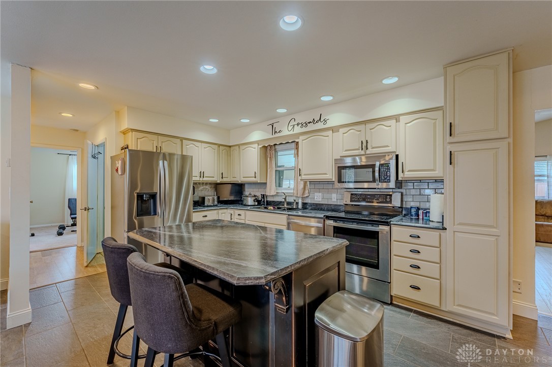 305 South Vandemark Road Sidney, OH 45365 - Photo 16 of 32 This spacious kitchen features ample counter space, a large island, and contemporary appliances.