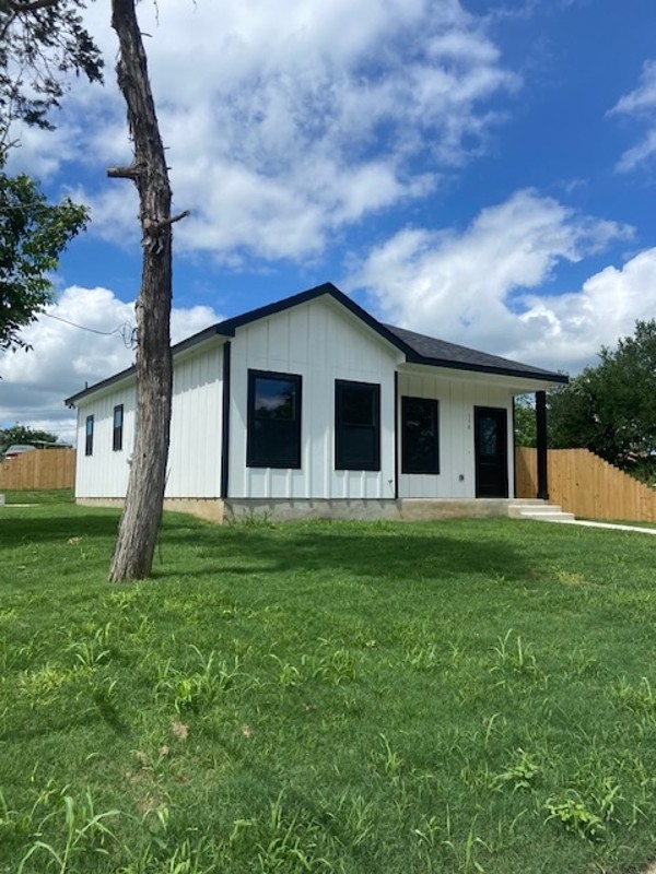 116 Field Street Luling, TX 78648 - Photo 2 of 33 A newly constructed residence features modern siding and a neatly maintained lawn.