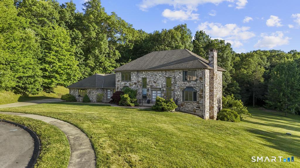 49 Partridge Lane Middletown, CT 06457 - Photo 3 of 39 a front view of a house with garden