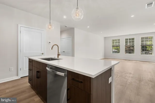 a kitchen with a sink cabinets and window