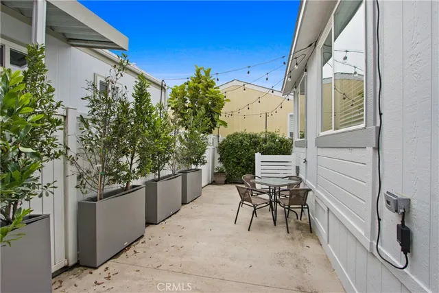 a view of a chair and table in the balcony