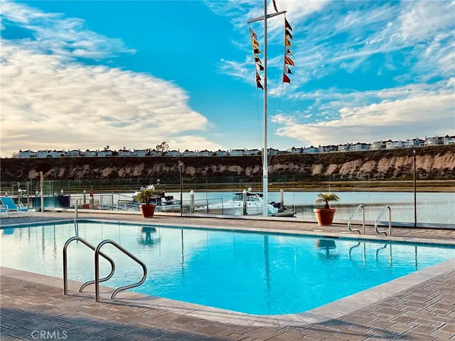 a swimming pool with outdoor seating