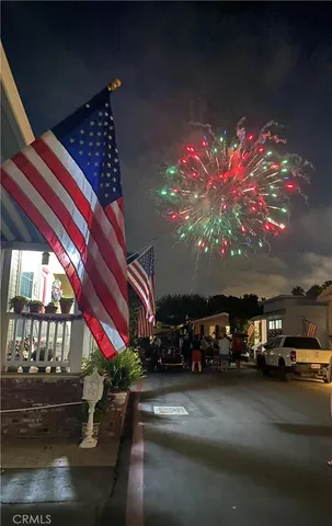 a view of a cars park in front of a house