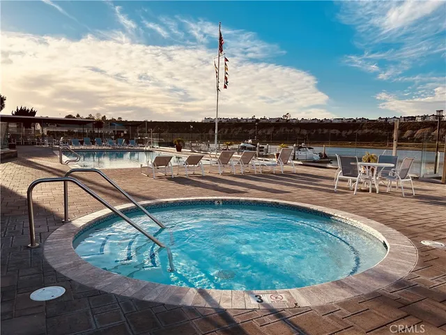 a view of a swimming pool with outdoor seating