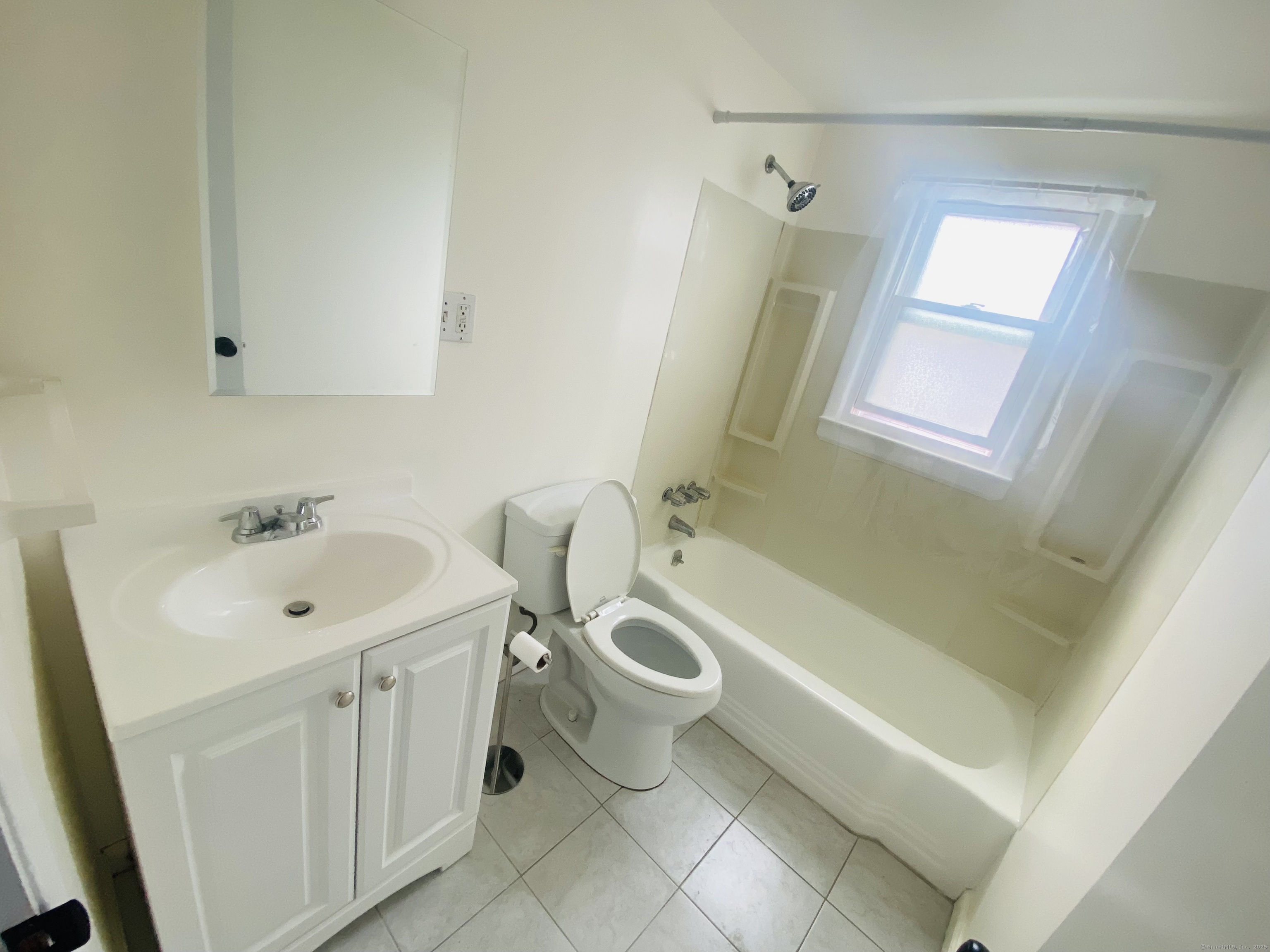 35 Harding Avenue Stratford, CT 06615 - Photo 10 of 10 a bathroom with a sink toilet and shower