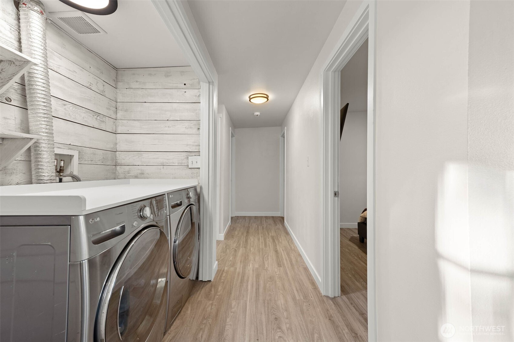 503 Coe Lane Southwest Orting, WA 98360 - Photo 13 of 26 a view of a bathroom with a sink and wooden floor