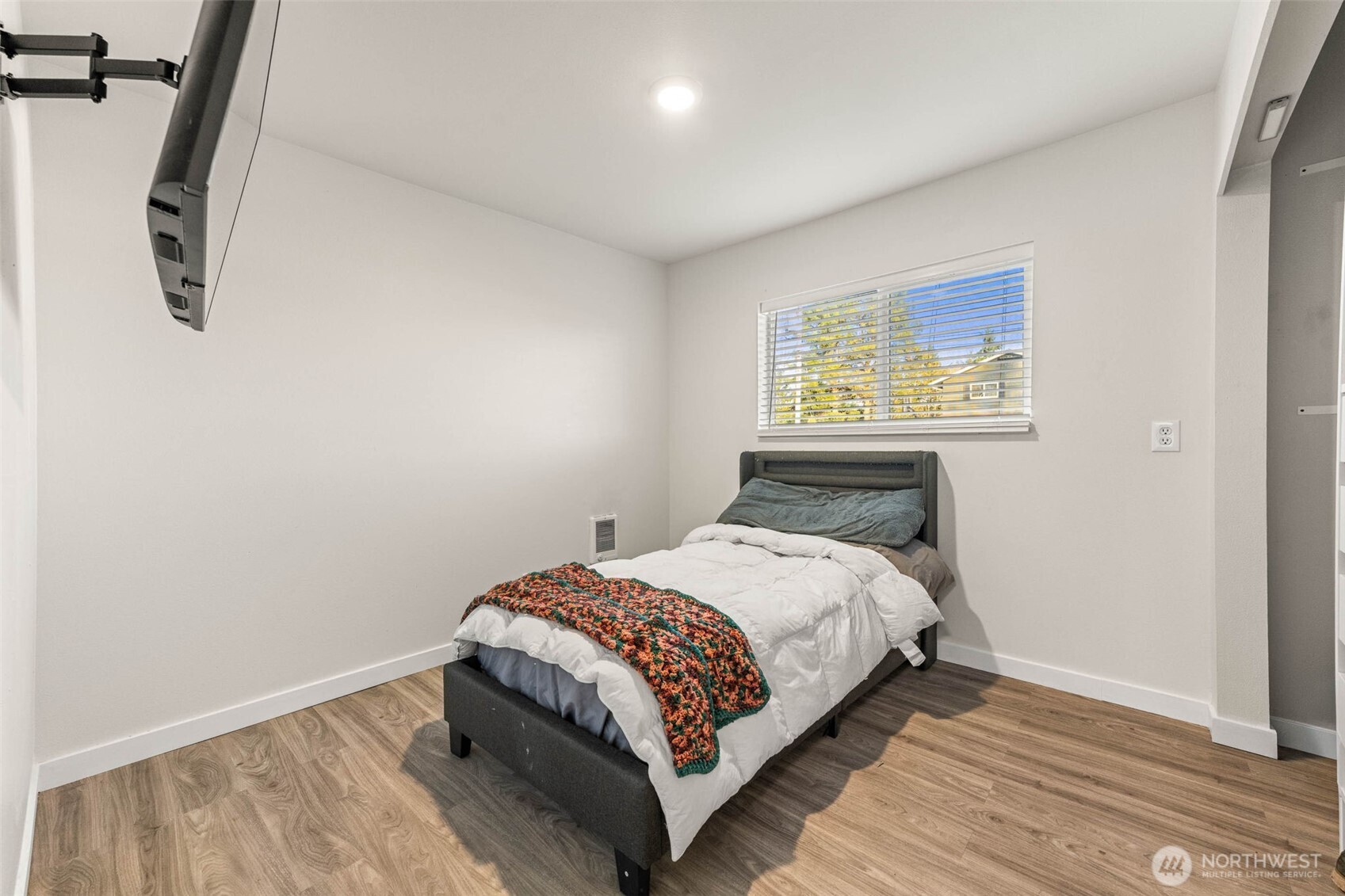 503 Coe Lane Southwest Orting, WA 98360 - Photo 15 of 26 a bedroom with a bed and a window