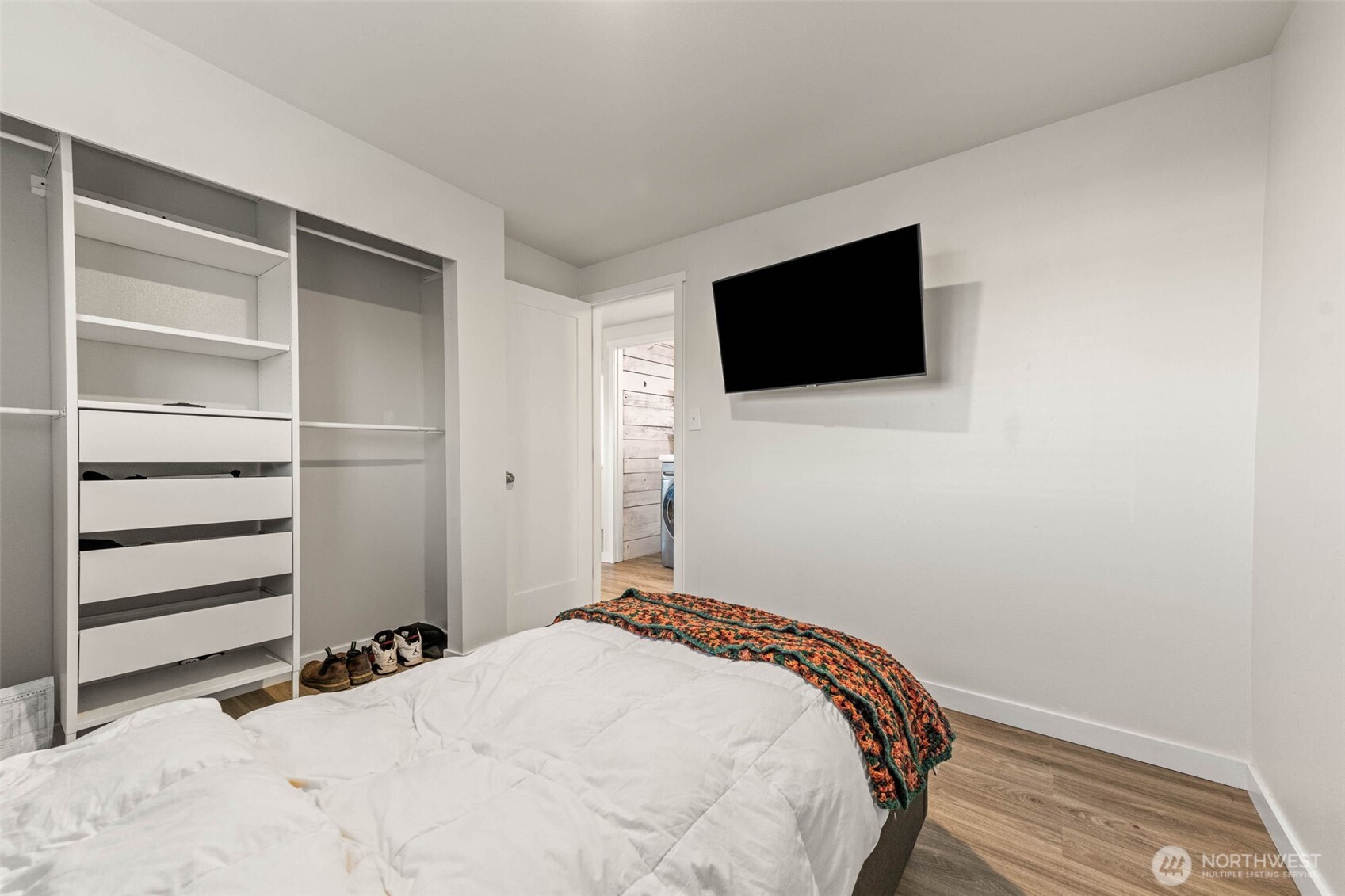 503 Coe Lane Southwest Orting, WA 98360 - Photo 16 of 26 a bedroom with a bed and a flat screen tv