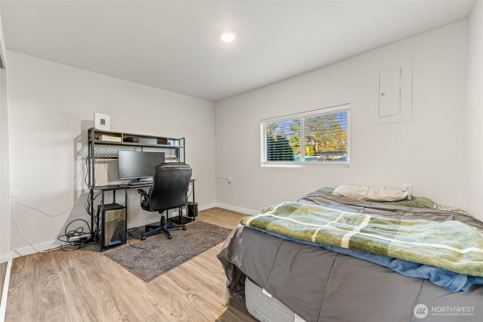 503 Coe Lane Southwest Orting, WA 98360 - Photo 17 of 26 a bedroom with a bed and a desk