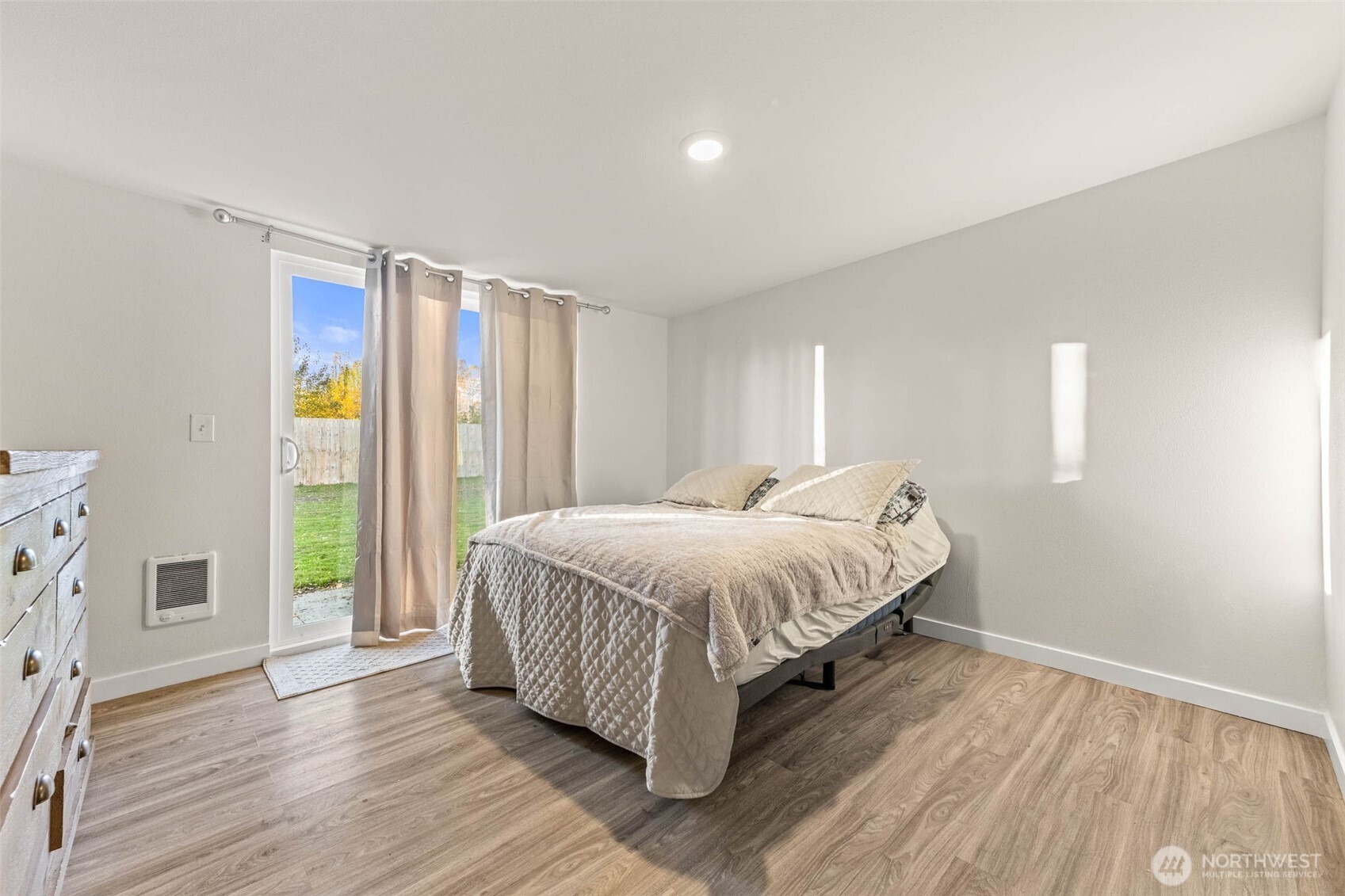 503 Coe Lane Southwest Orting, WA 98360 - Photo 19 of 26 a spacious bedroom with a bed and a window
