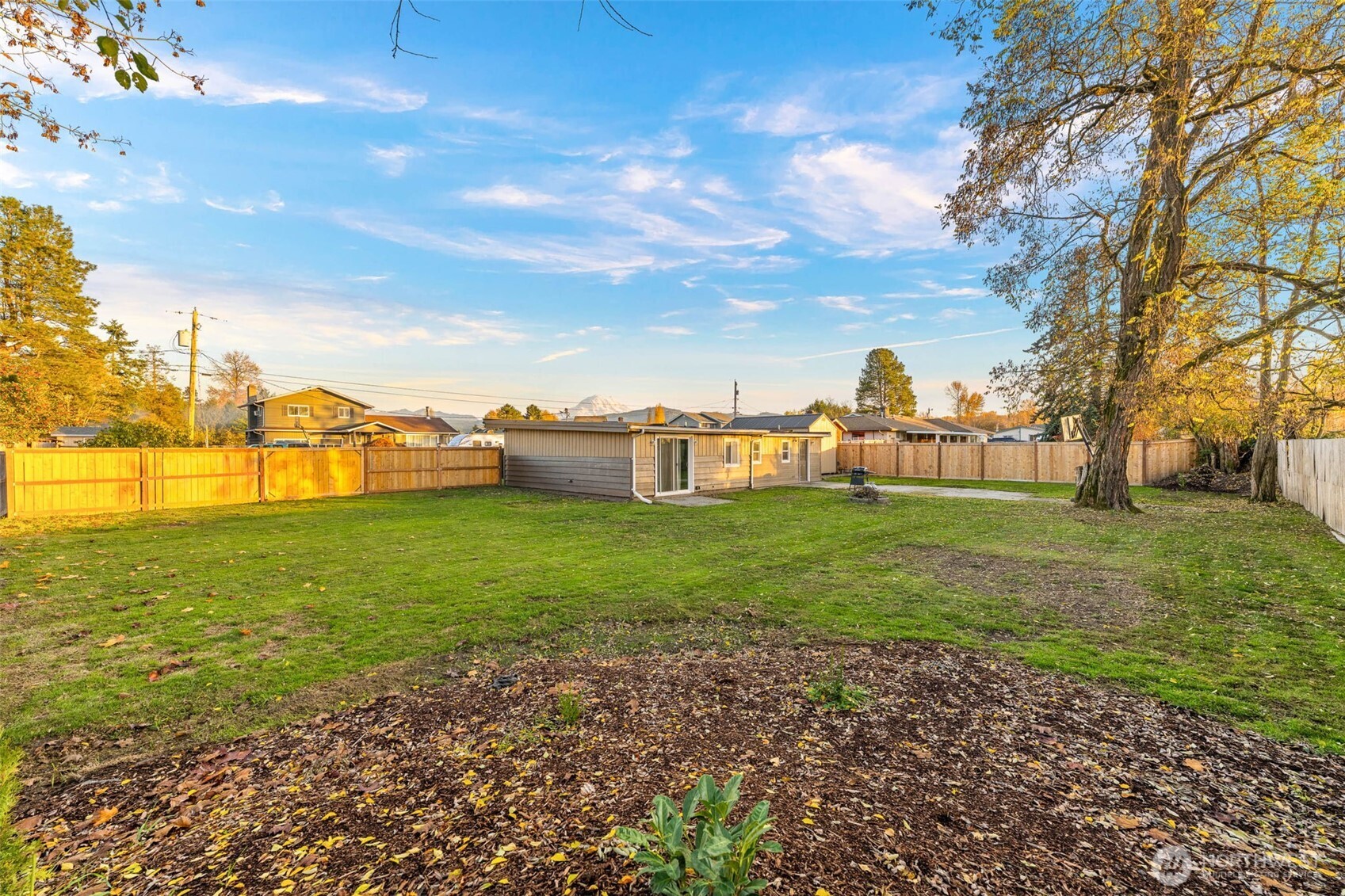 503 Coe Lane Southwest Orting, WA 98360 - Photo 24 of 26 a view of a garden with a building in the background