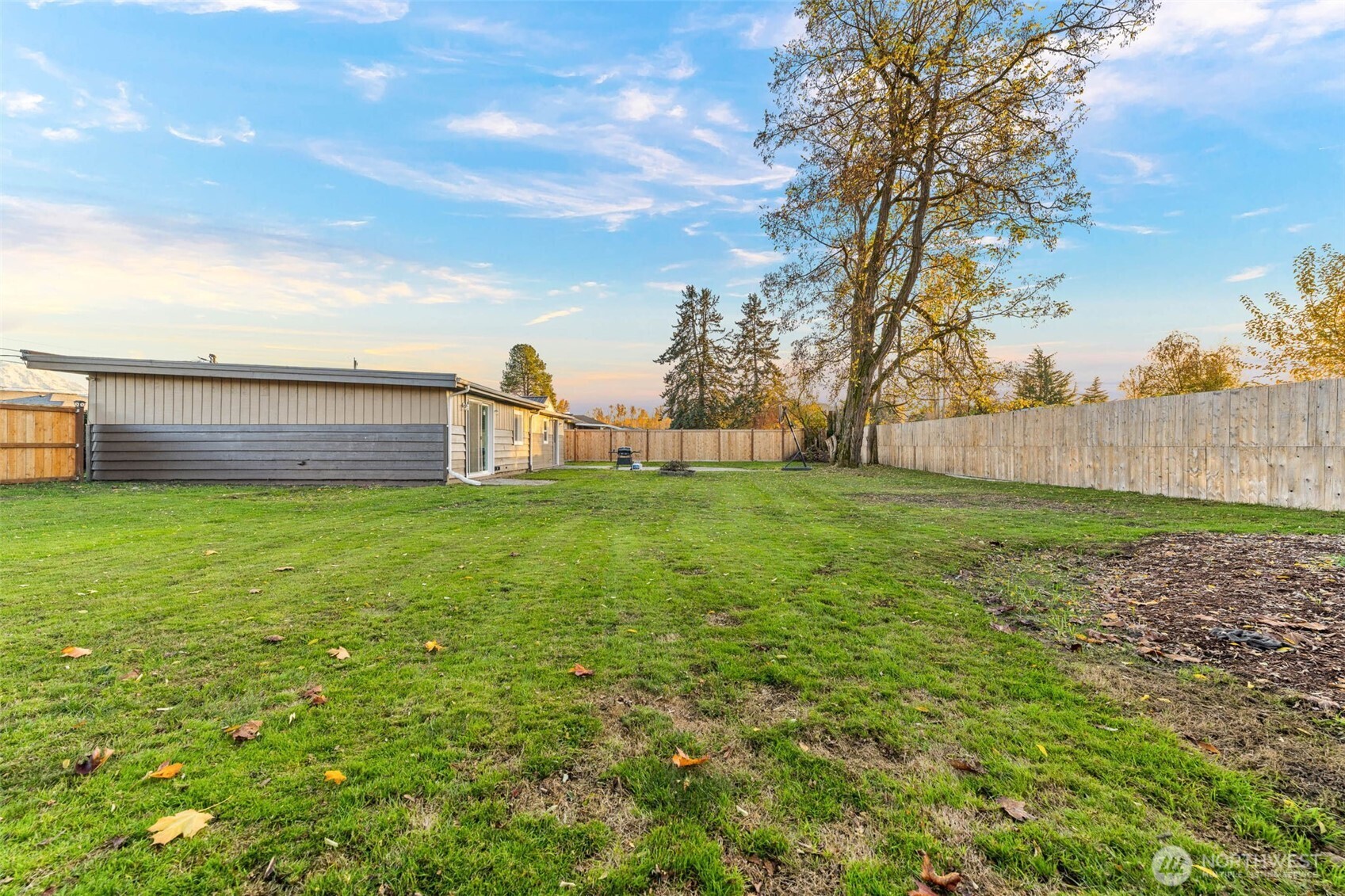 503 Coe Lane Southwest Orting, WA 98360 - Photo 25 of 26 a view of a house with a yard