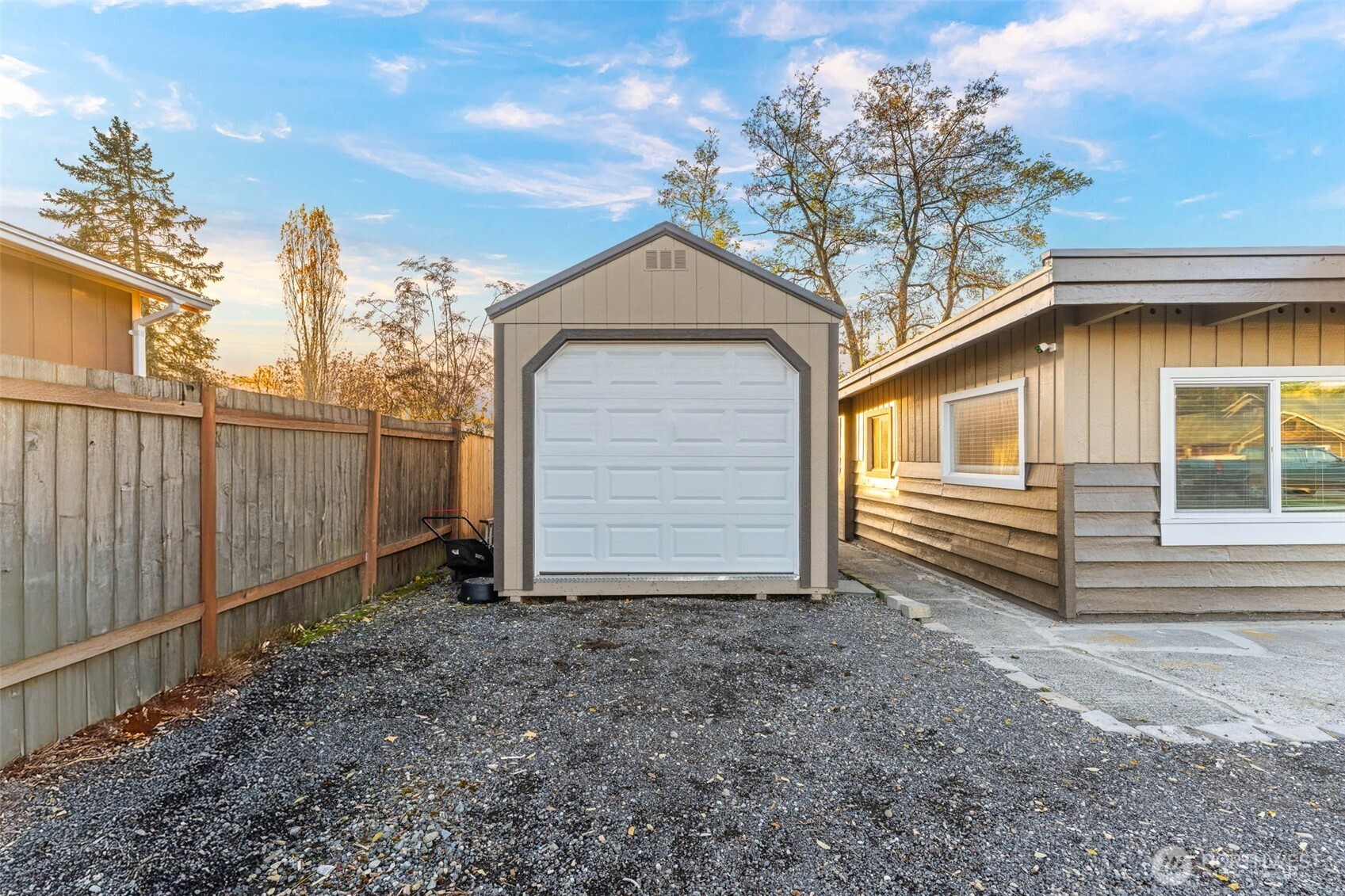 503 Coe Lane Southwest Orting, WA 98360 - Photo 3 of 26 a view of a house with a yard and tree