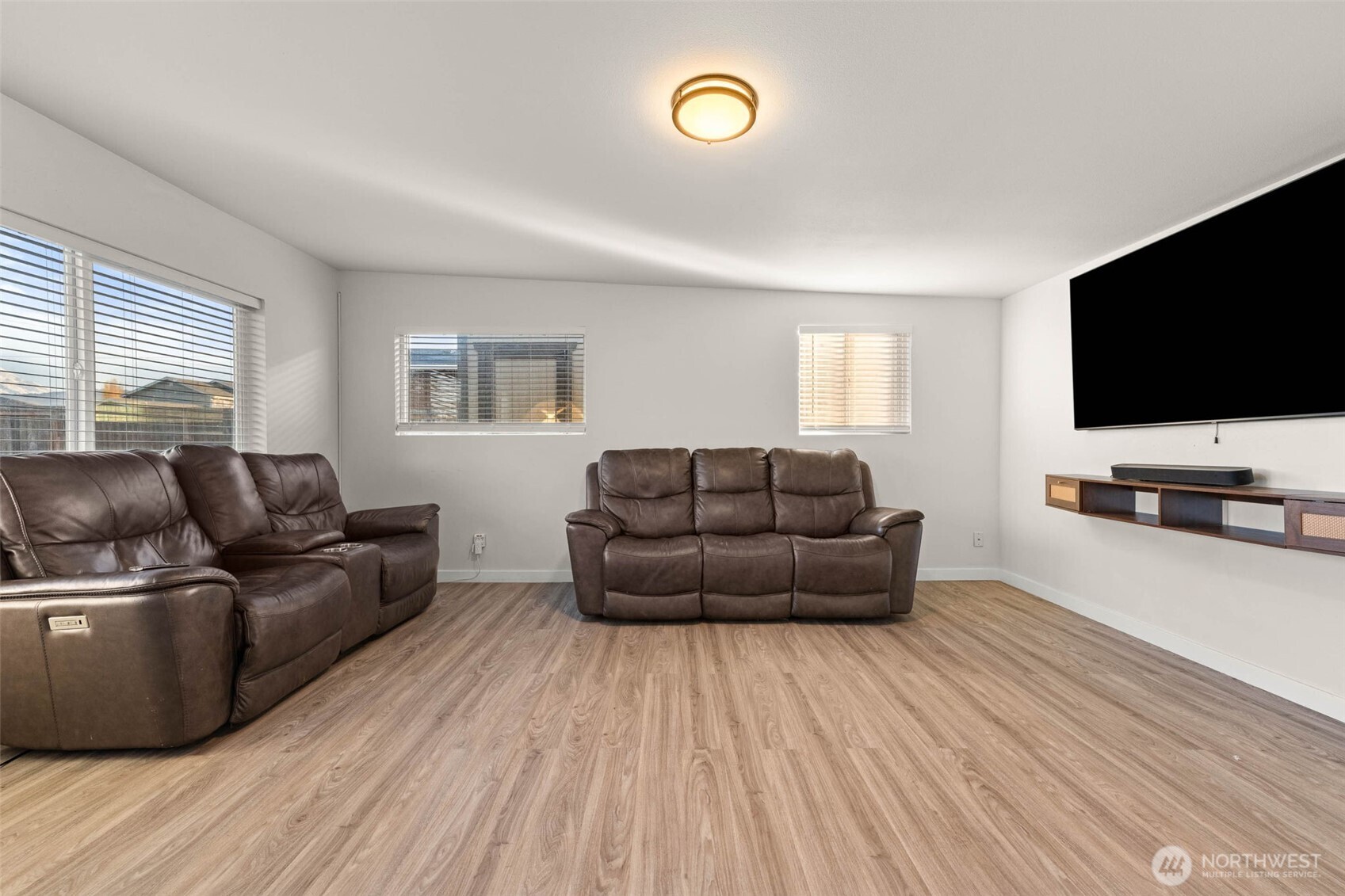 503 Coe Lane Southwest Orting, WA 98360 - Photo 6 of 26 a living room with furniture and a flat screen tv