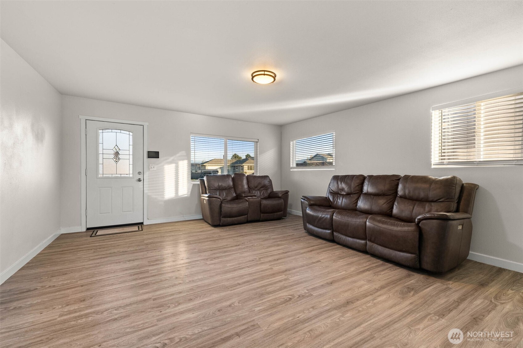 503 Coe Lane Southwest Orting, WA 98360 - Photo 7 of 26 a living room with furniture and a wooden floor