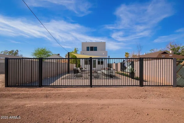 a view of a roof deck with wooden fence