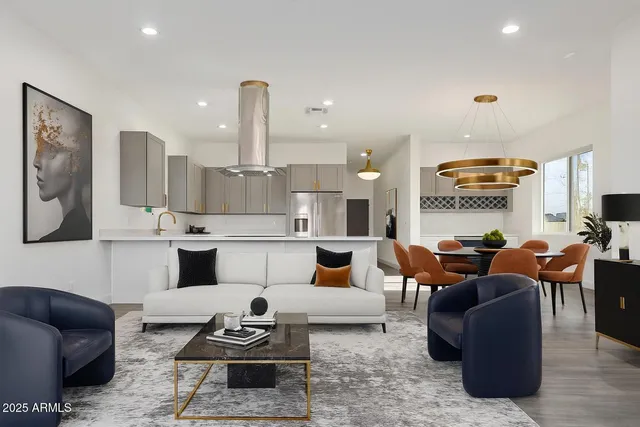 a living room with furniture and kitchen view