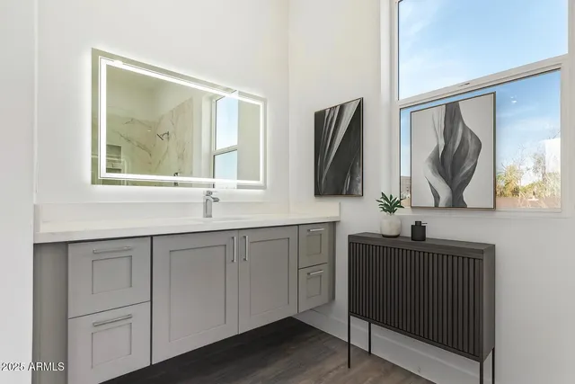 a bathroom with a sink and a mirror