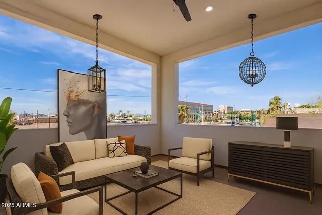 a view of a livingroom with furniture and chandelier