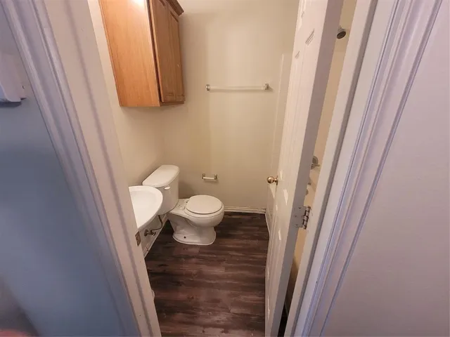 a bathroom with a toilet and a sink