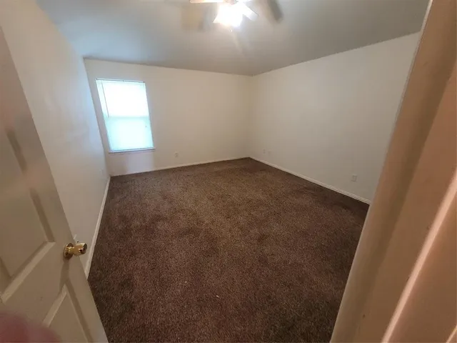 a bathroom with a sink a toilet a mirror and shower