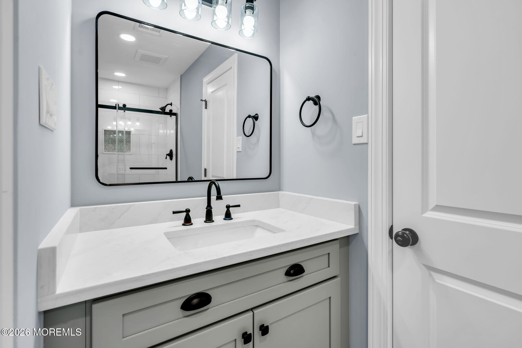 17 Meadowbrook Road Brick, NJ 08723 - Photo 18 of 36 a bathroom with a sink and a mirror