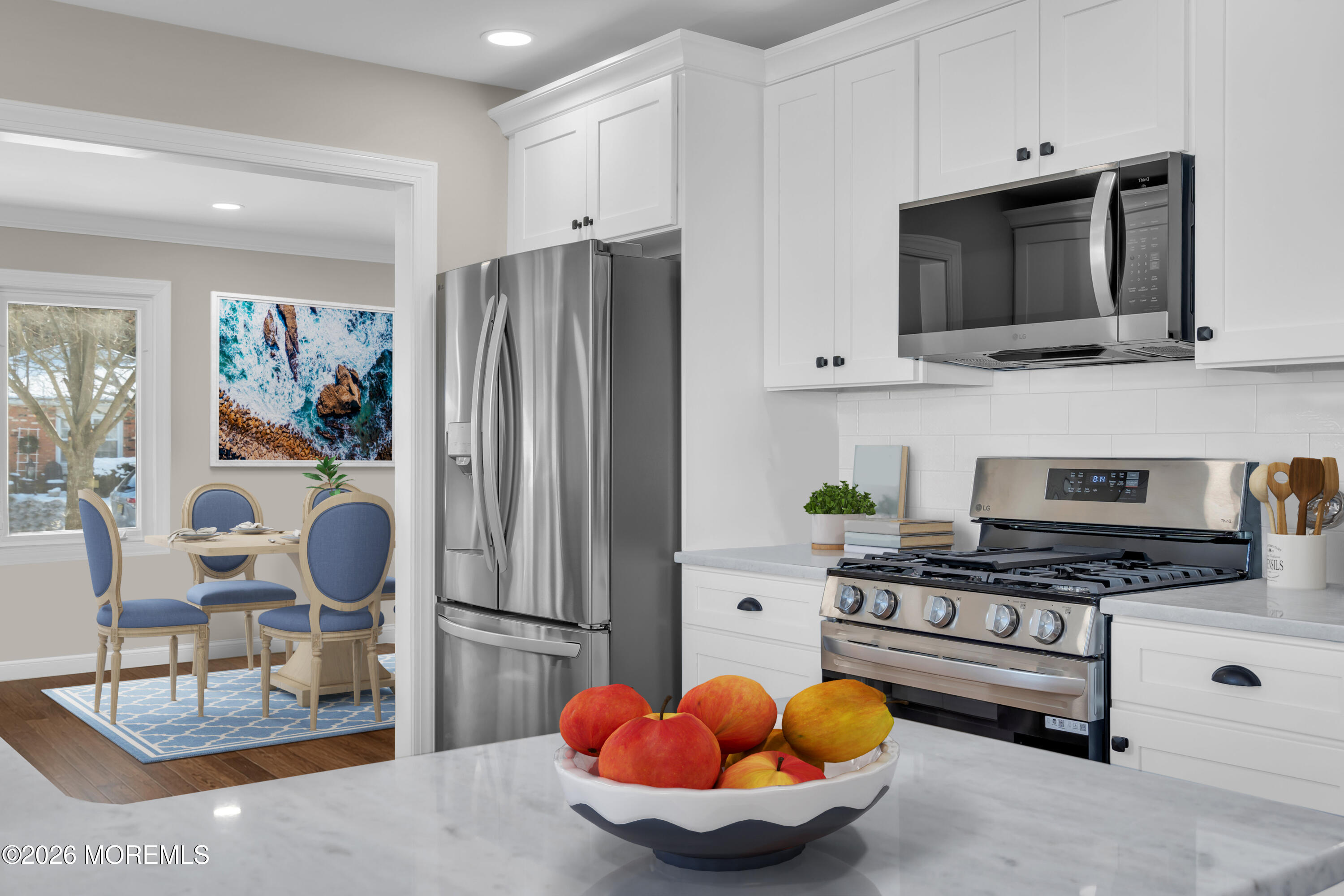 17 Meadowbrook Road Brick, NJ 08723 - Photo 2 of 36 a kitchen with stainless steel appliances a stove a microwave and cabinets