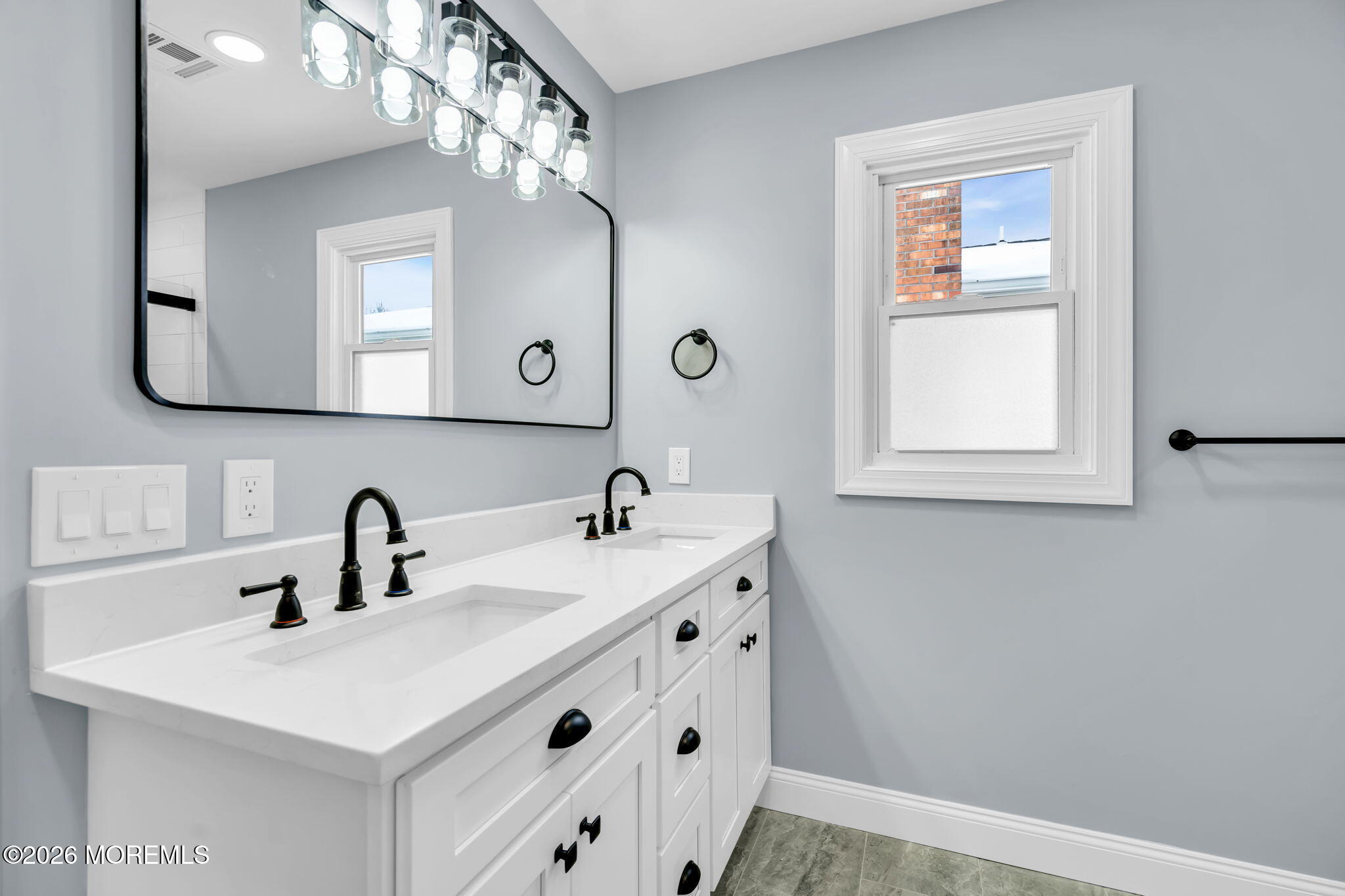 17 Meadowbrook Road Brick, NJ 08723 - Photo 24 of 36 a bathroom with a sink and a mirror